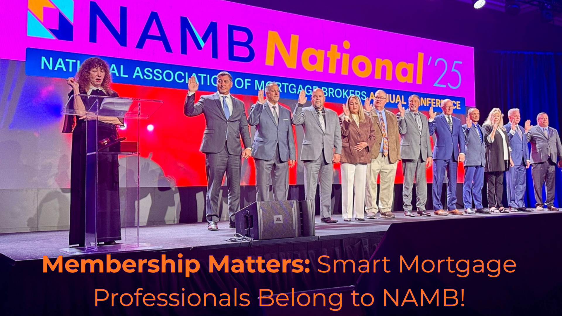 NAMB National 25 conference stage with speakers in gray suits and a banner reading “Membership Matters.”