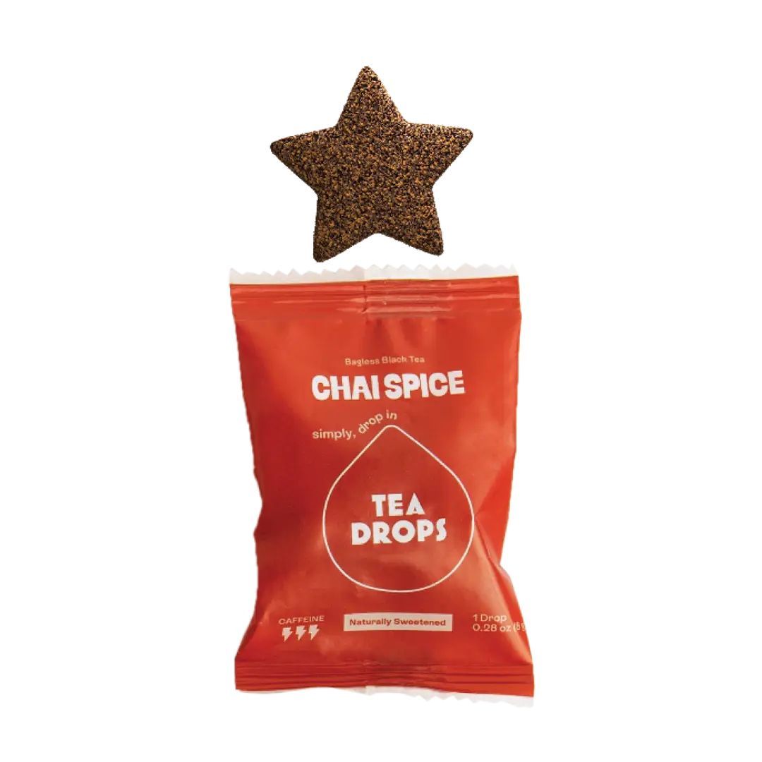 A star-shaped Chai Spice Tea Drop sits above its red packaging, which features the white Tea Drops logo and text.