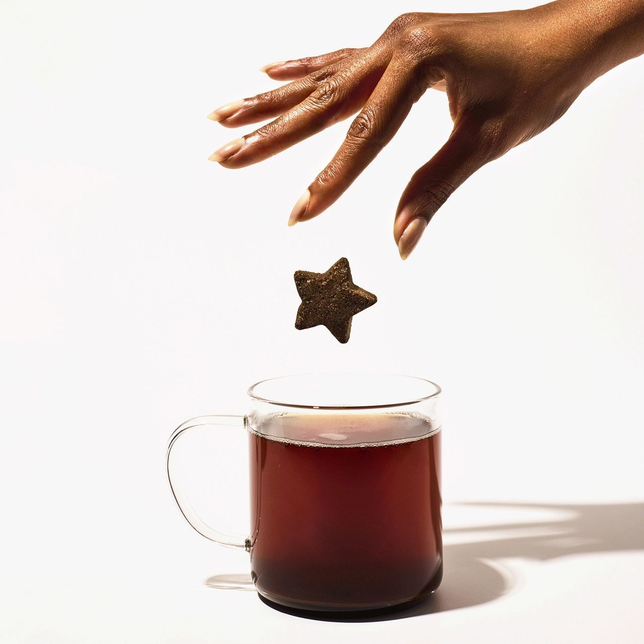 A star-shaped Chai Spice Tea Drop sits above its red packaging, which features the white Tea Drops logo and text.