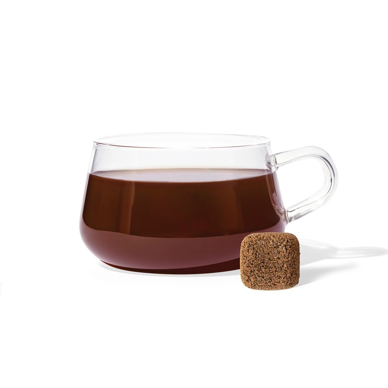 A packet of Chocolate Earl Grey Tea Drops with a single square tea drop positioned above it.