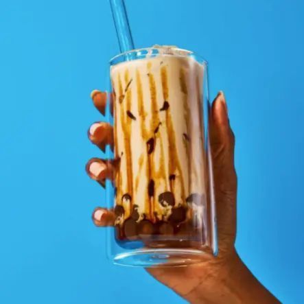 Five vacuum-sealed packs of brown sugar instant boba pearls arranged in a row against a plain white background.