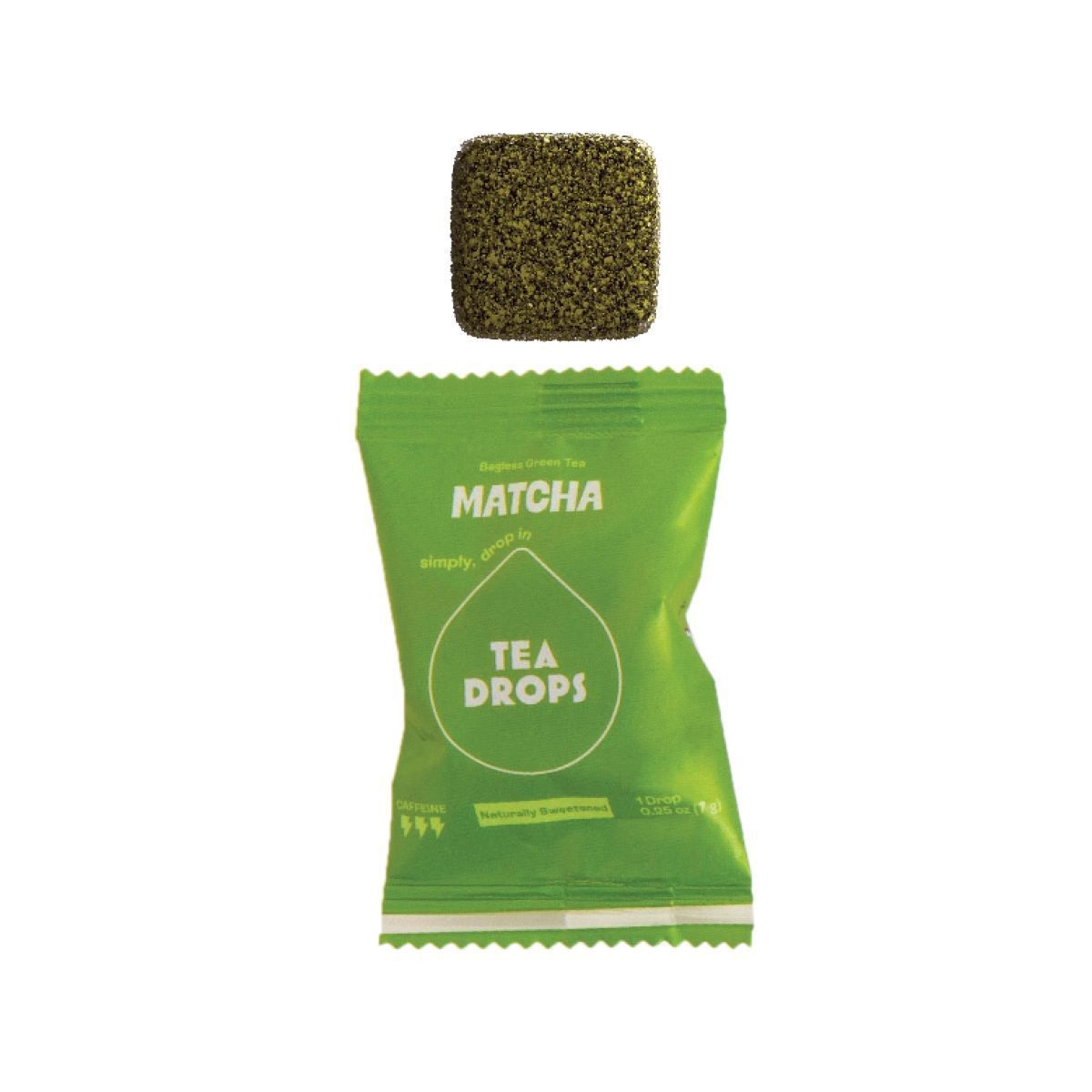 A single square matcha tea tablet placed above its small, lime green individual tea wrapper.