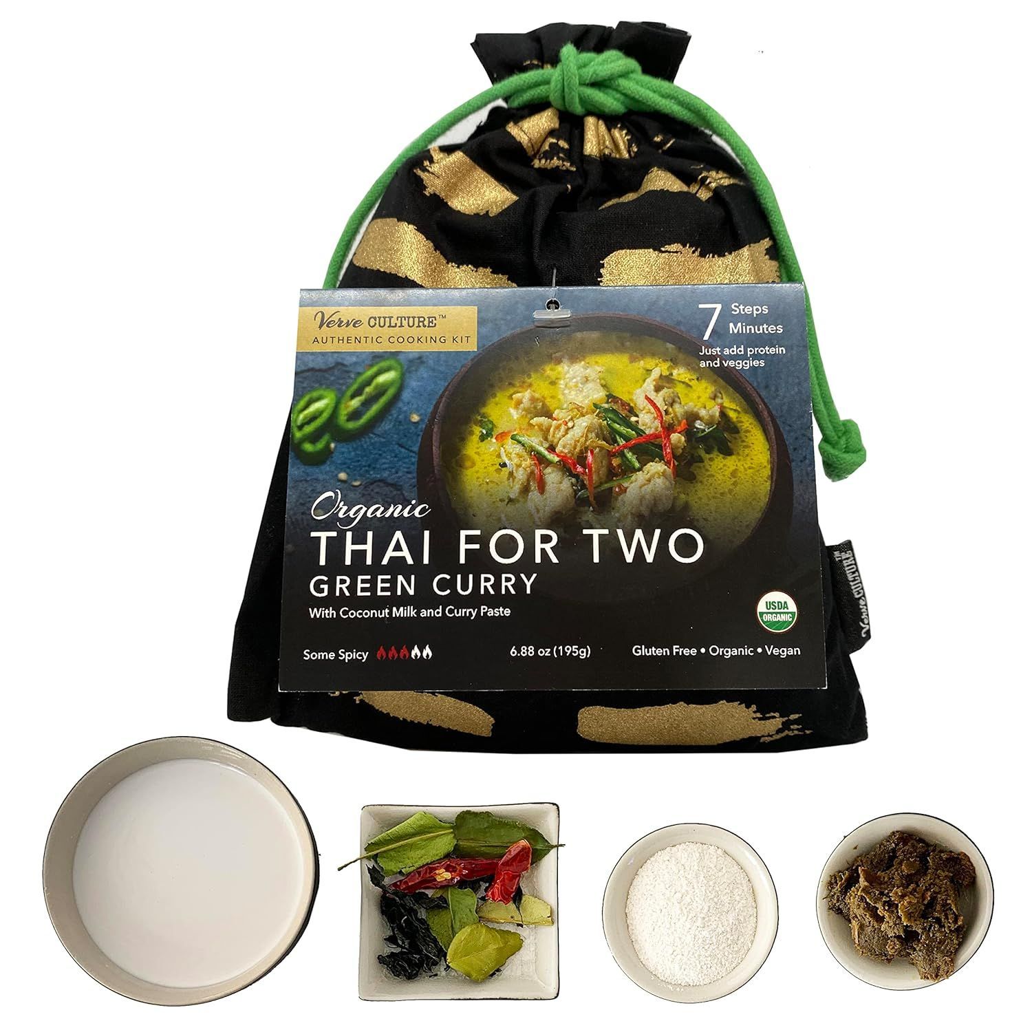 A package of Thai For Two organic green curry kit, presented in a black fabric drawstring bag with gold brushstrokes.