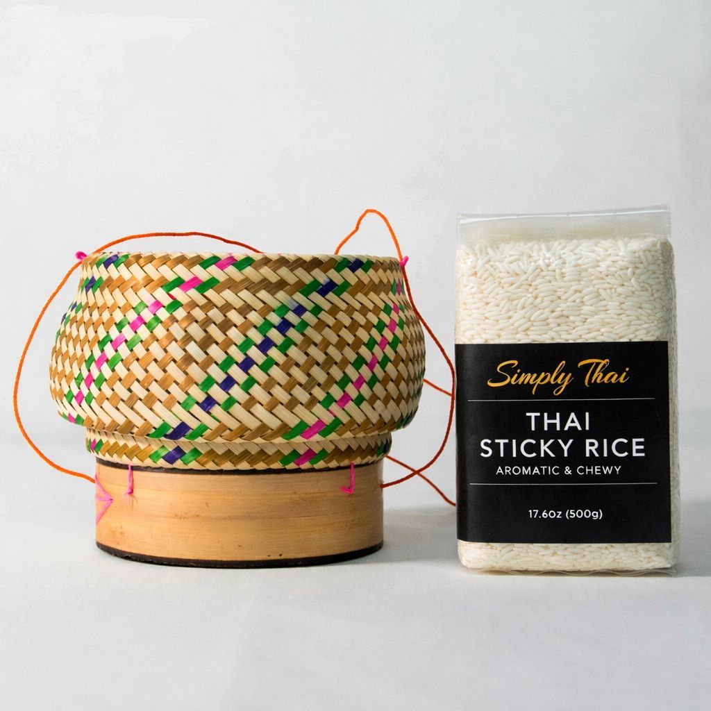 A clear bag of white Thai sticky rice with a black label reading