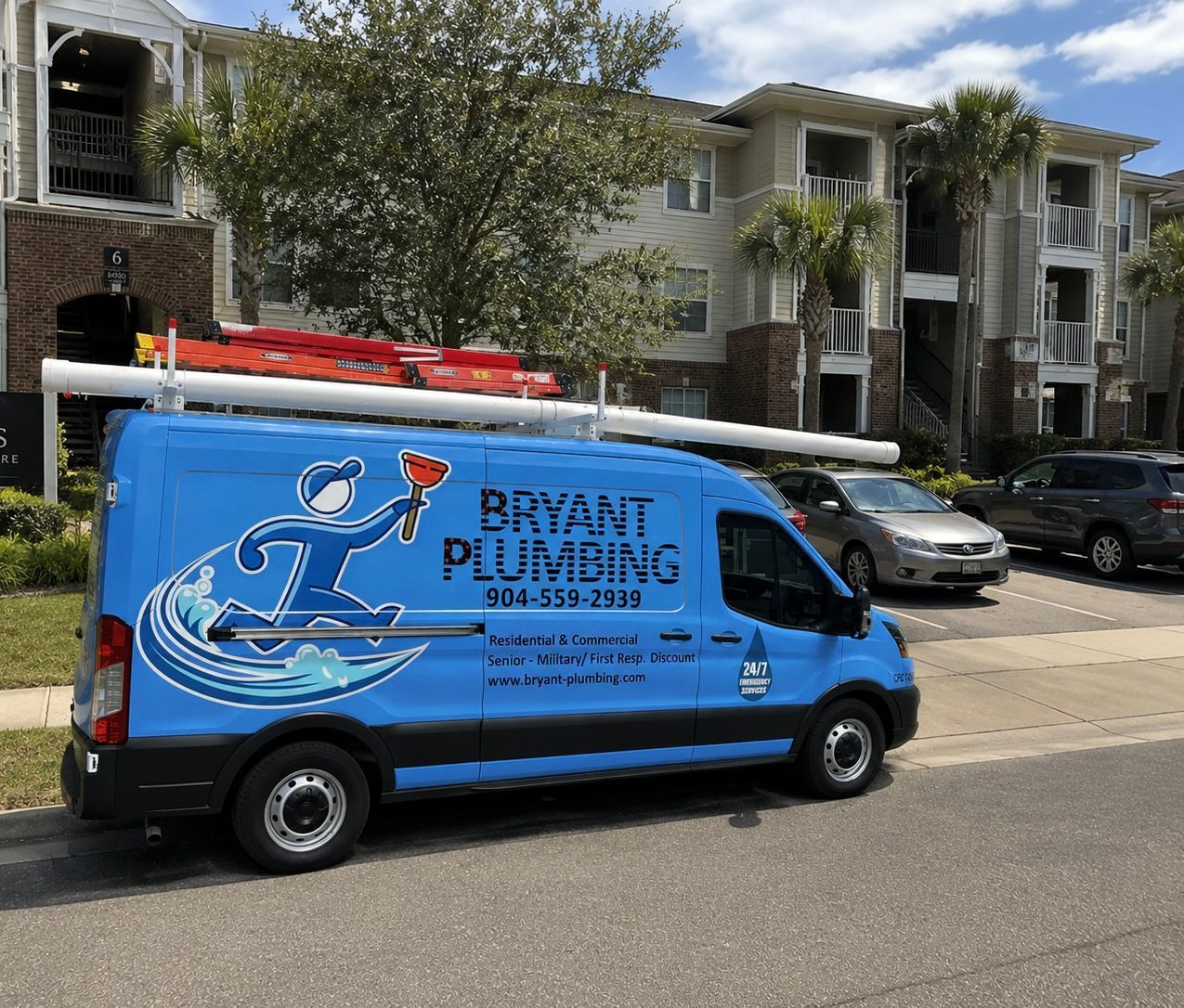Blue Bryan Plumbing van parked in front of apartment buildings with palm trees.
