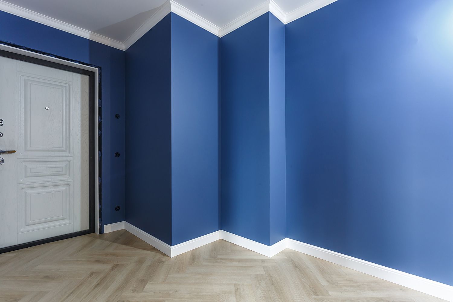 An empty room with deep blue walls