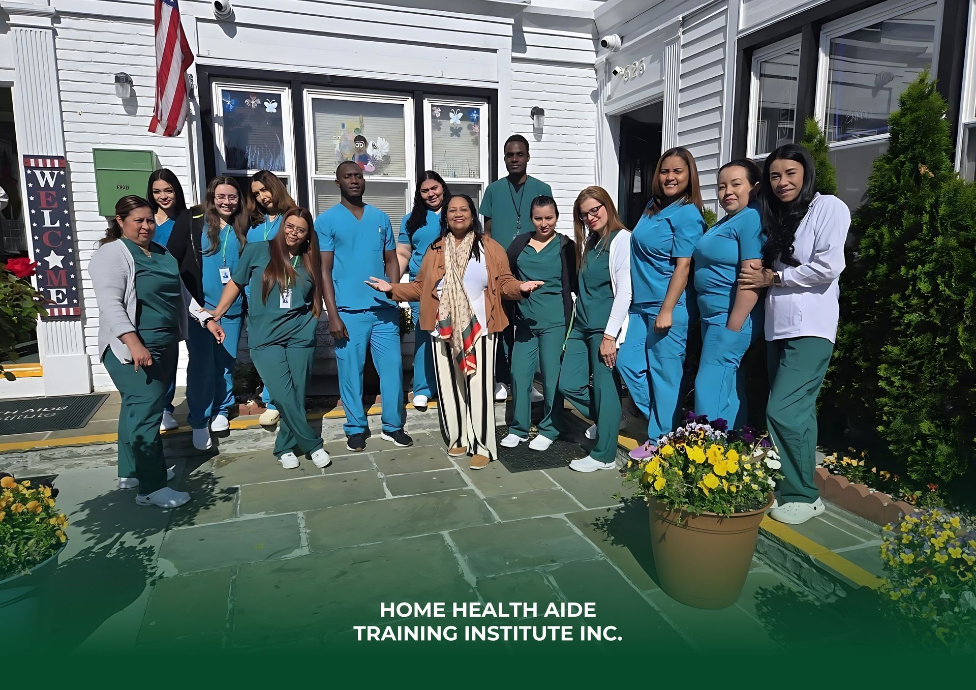 A group of people wearing blue scrubs and casual clothes stand outside a building for a Home Health Aide training program.