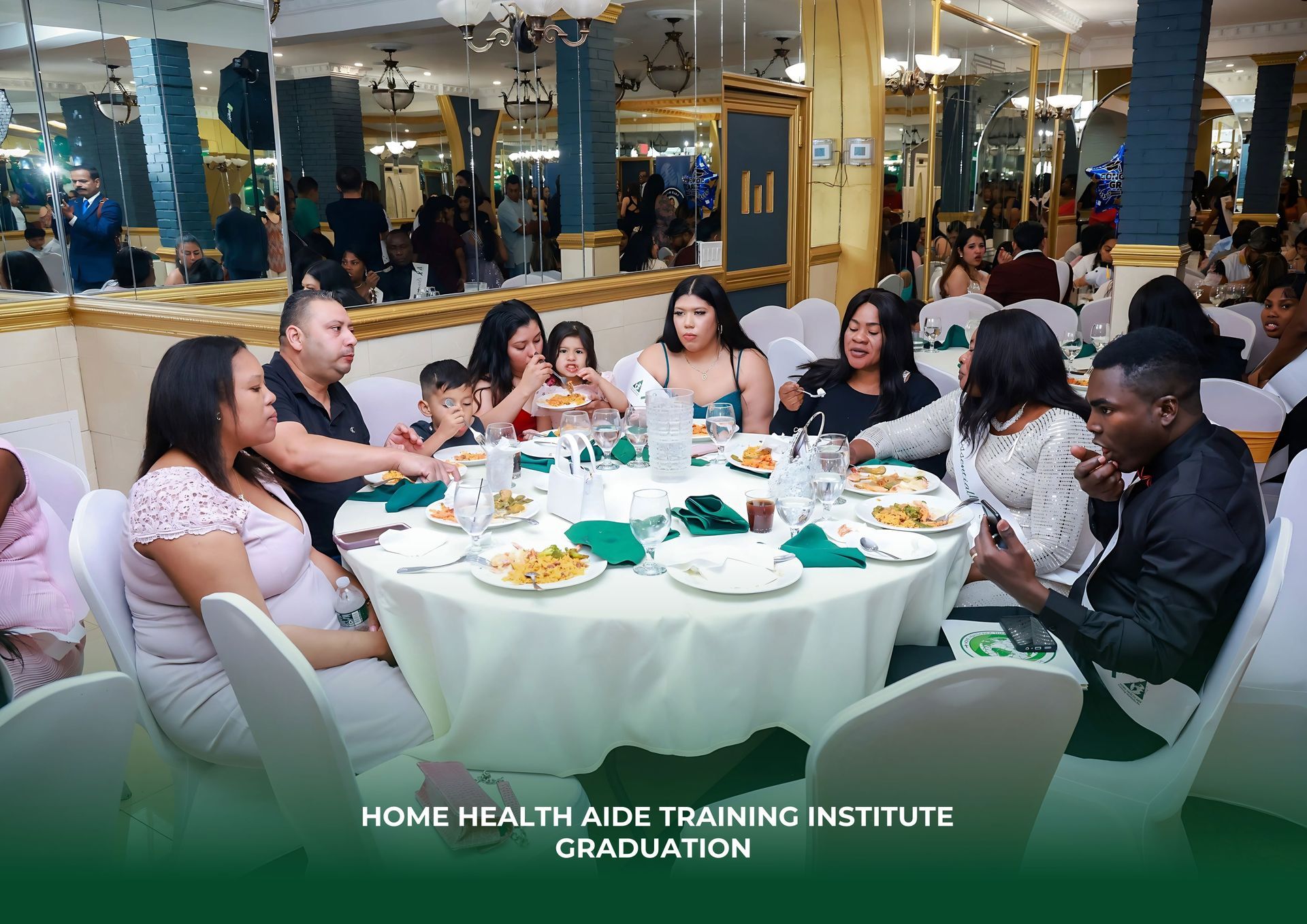 People sit at a round table enjoying a meal during a Home Health Aide Training Institute graduation event.