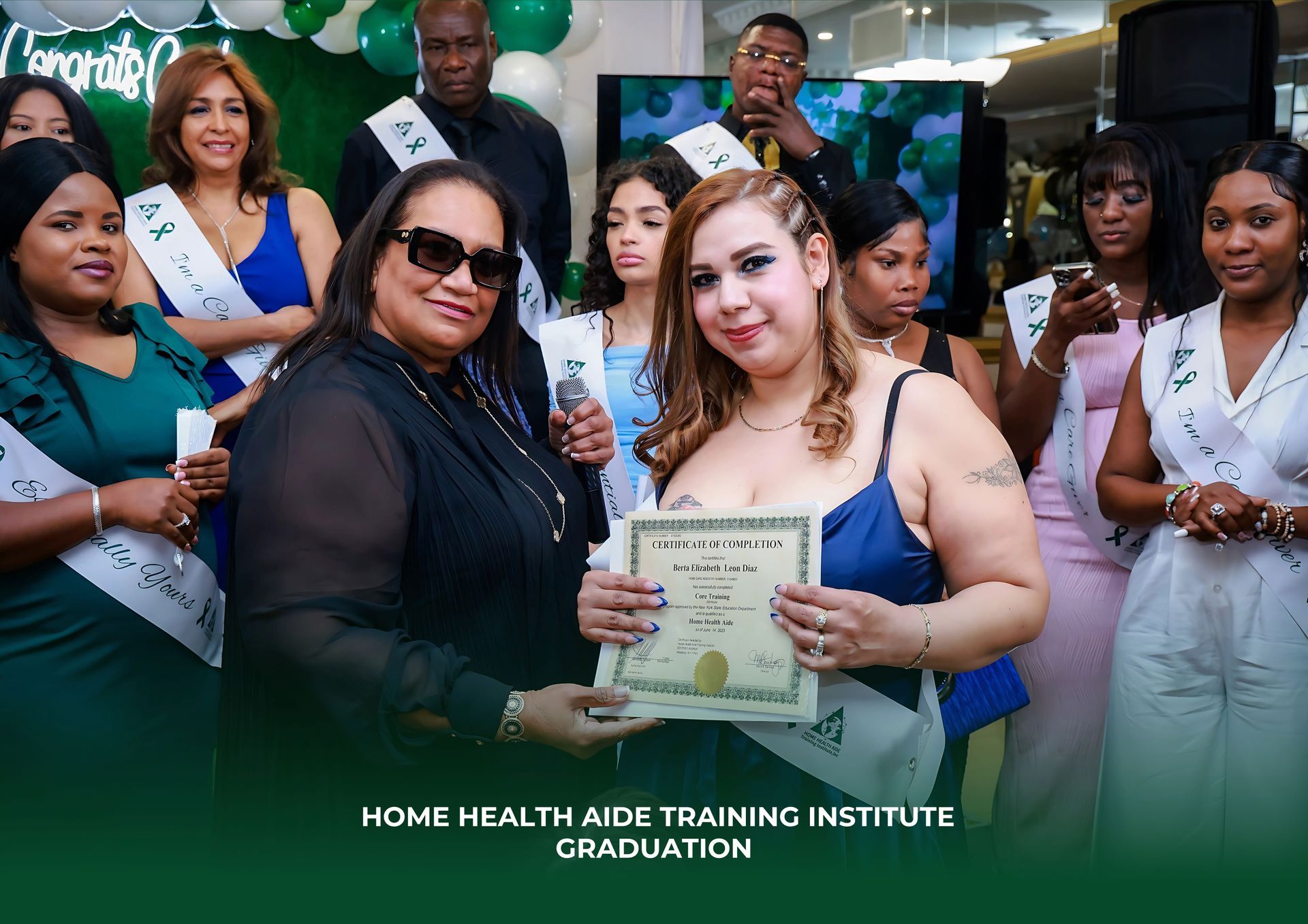 Graduates holding a certificate at the Home Health Aide Training Institute graduation ceremony.