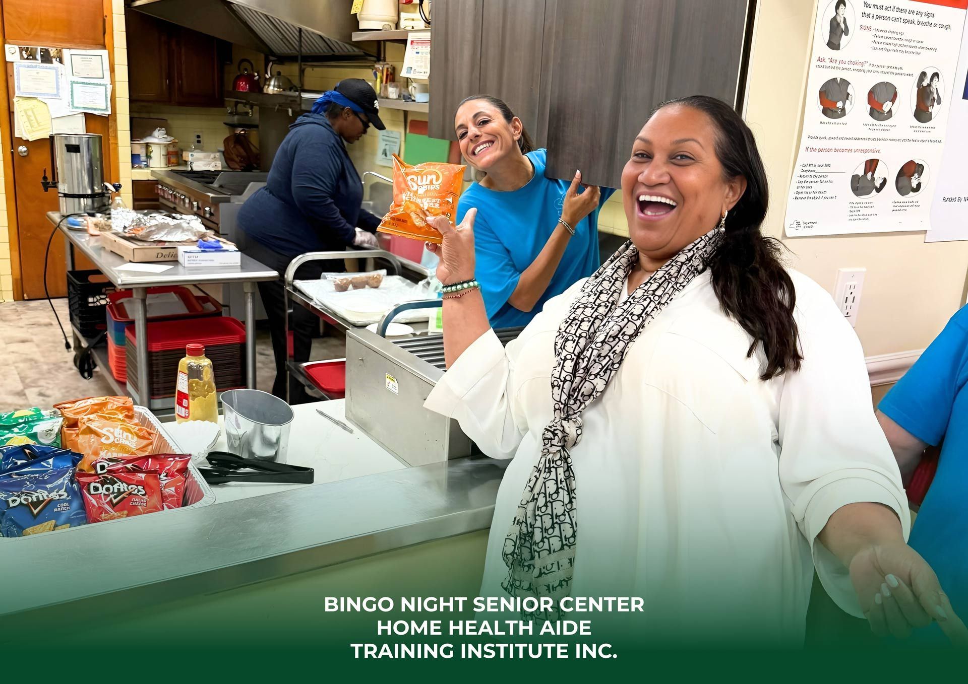 People laughing and preparing snacks in a kitchen at the Home Health Aide Training Institute for Bingo Night.