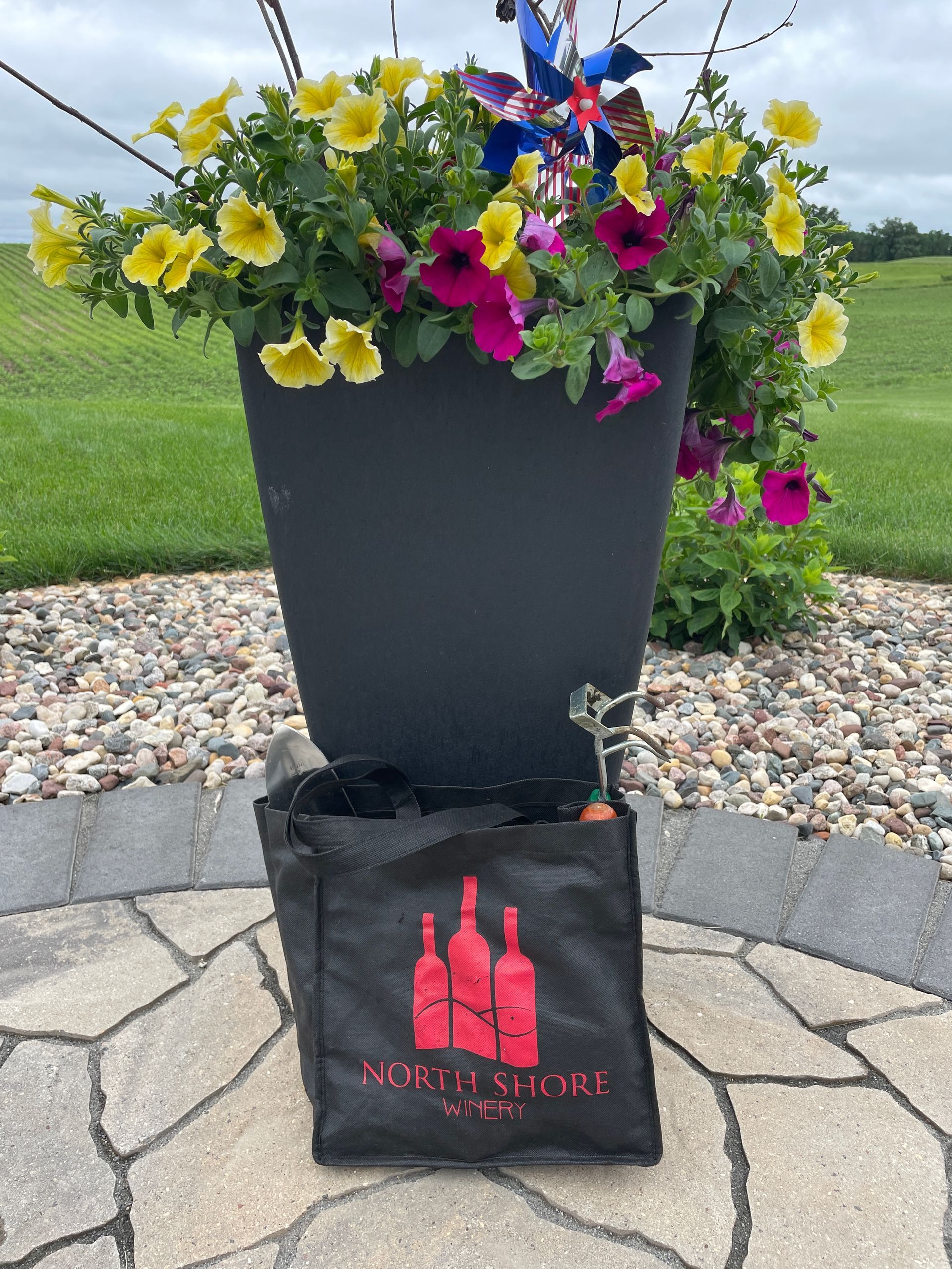 Flower container pot with a bag of tools