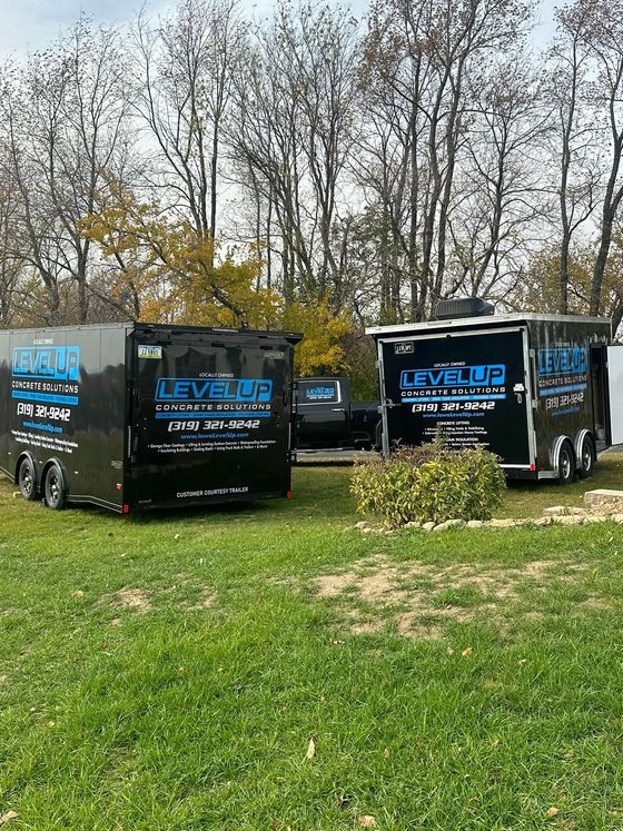 Two black trailers with