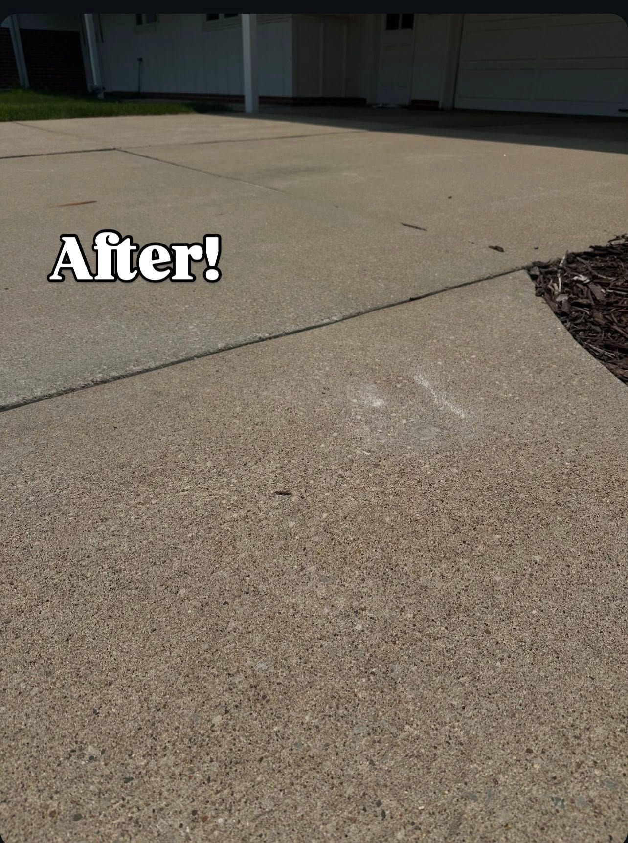Concrete driveway after cleaning, with 