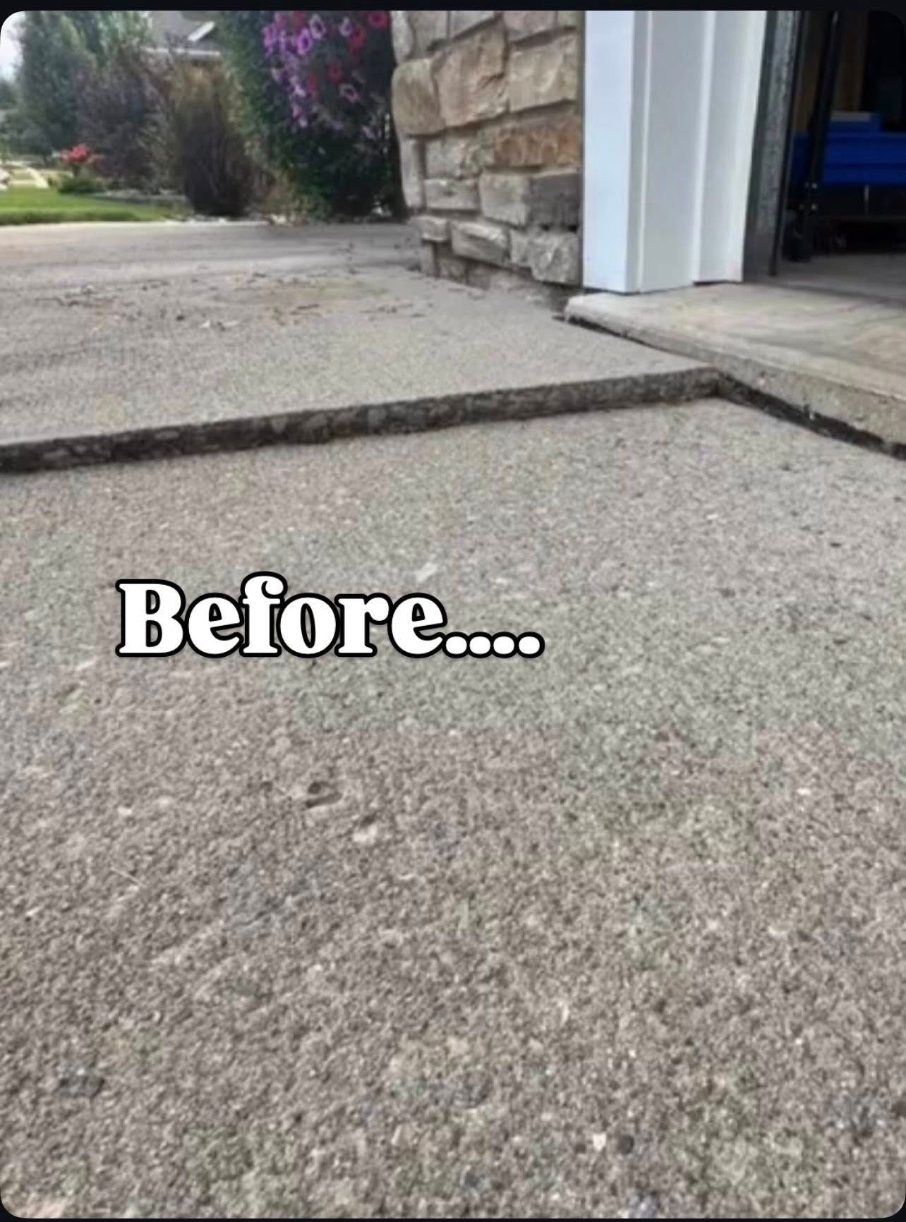 Concrete driveway before repair; lip at garage entrance.