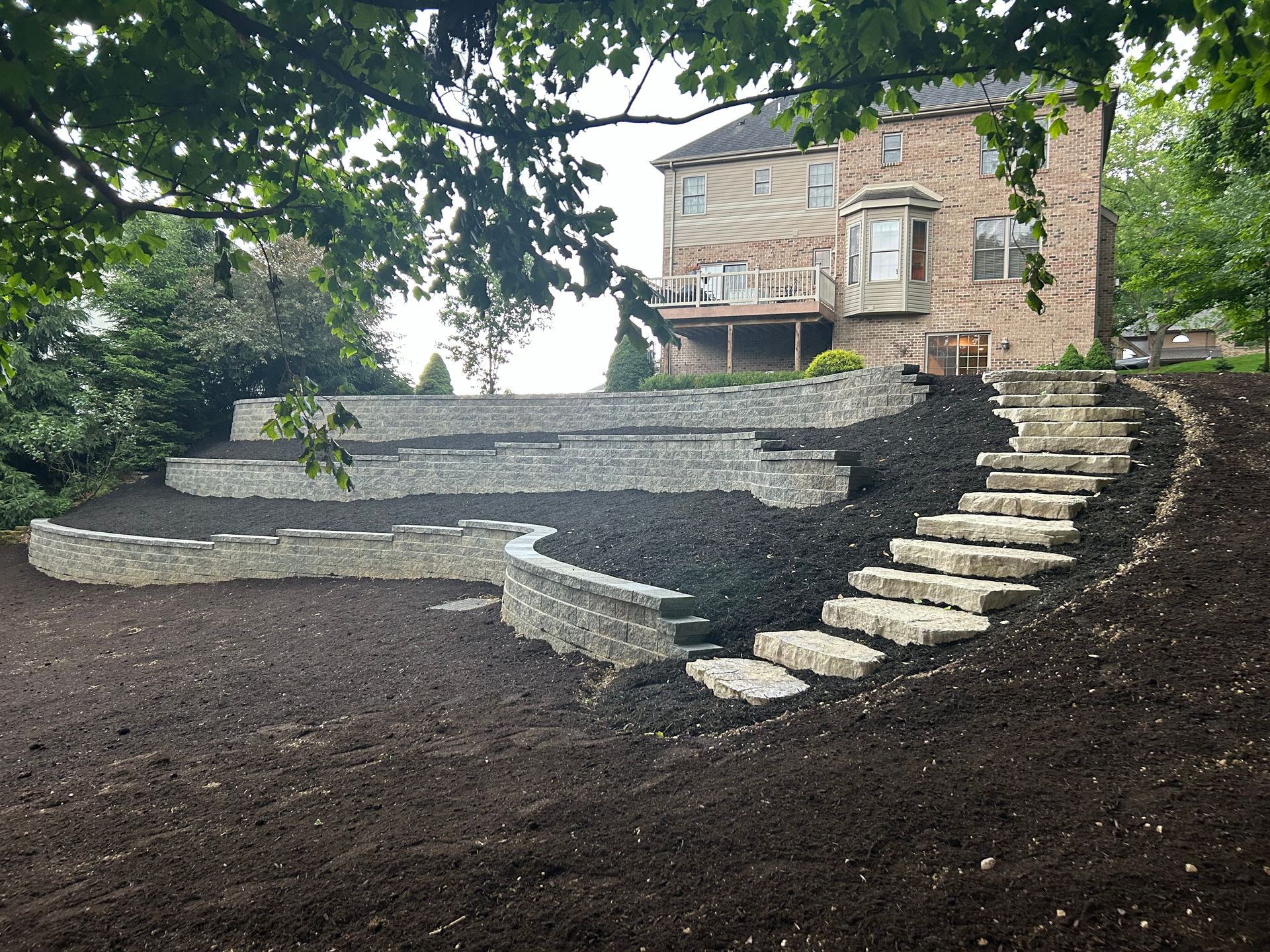 A large house with stairs leading up to it