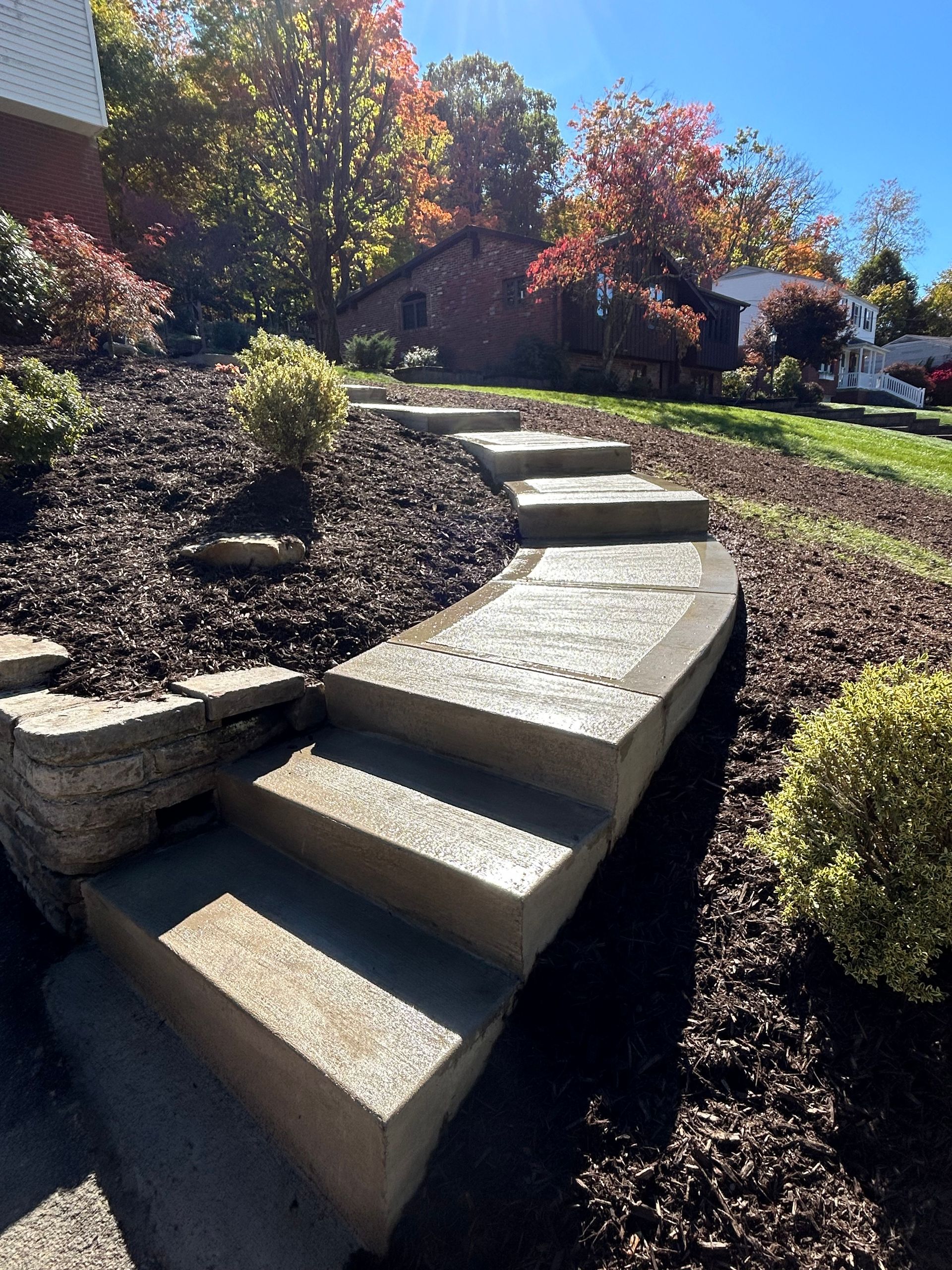 A set of concrete steps leading up to a house