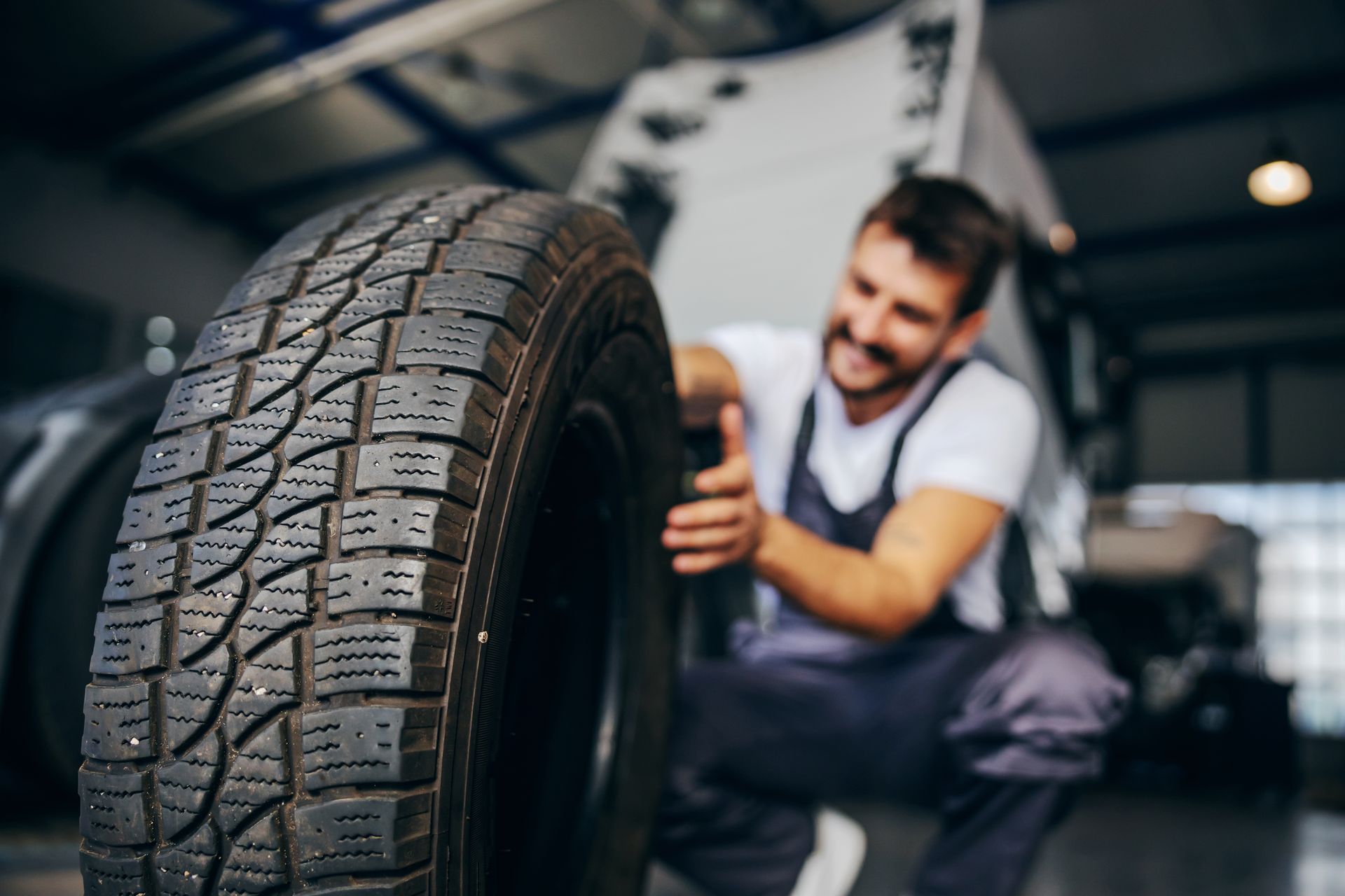 Mechanic working on tires | All Jacked Up