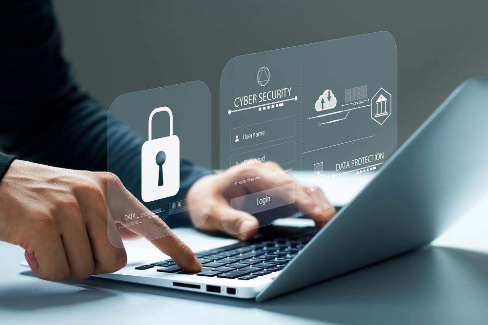 Hands Typing on a Laptop With a Padlock Icon and Cybersecurity Interface — Christies Accountants & Advisors In Dubbo, NSW
