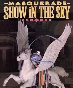 A white Pegasus with a rider in a mask, with the text