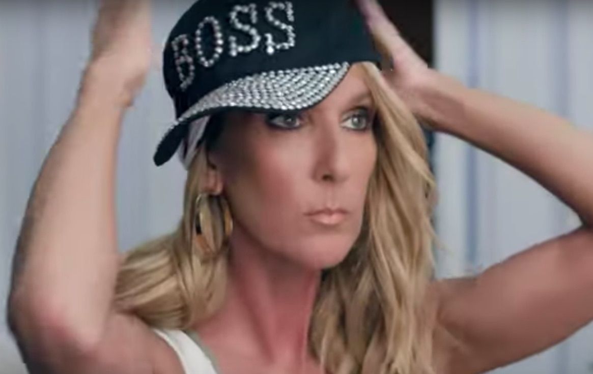 Celine Dion adjusts a black