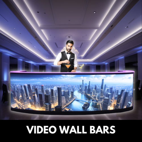 Bartender at video wall bar with city view.