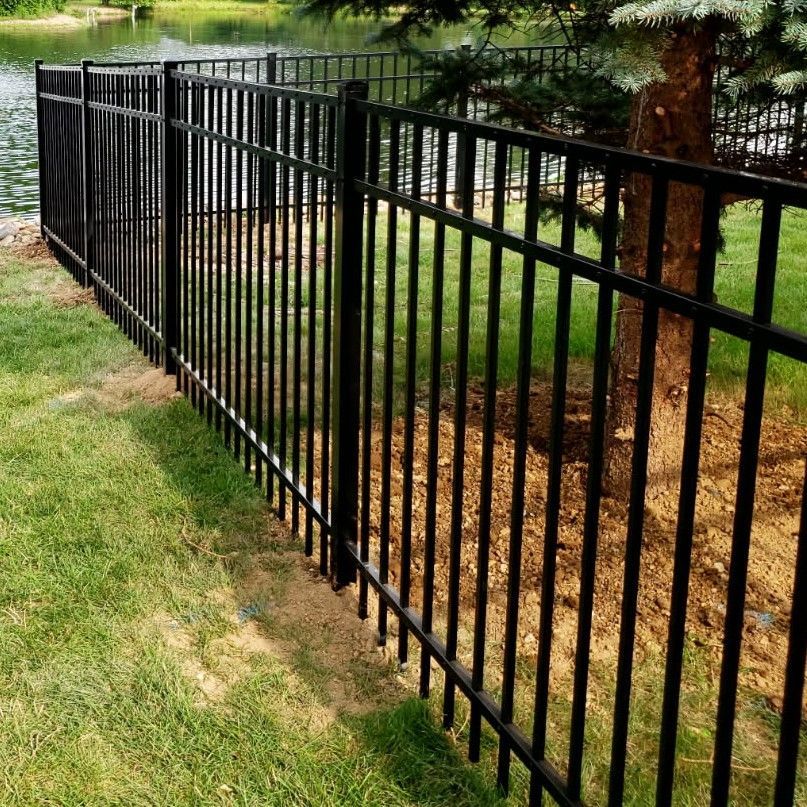 Wadsworth Aluminum fence around a tree