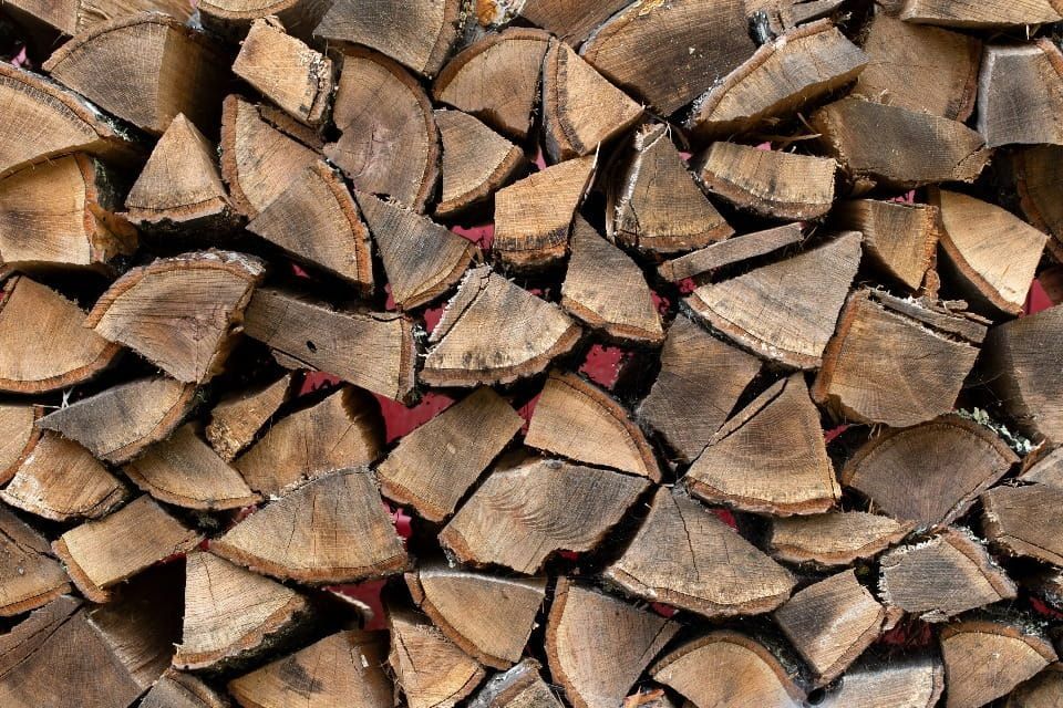 A Pile Of Chopped Wood Is Stacked On Top Of Each Other — Serious About Landscape Supplies In Terrigal, NSW