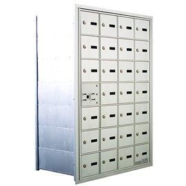 Silver metal mailbox unit with multiple individual compartments.