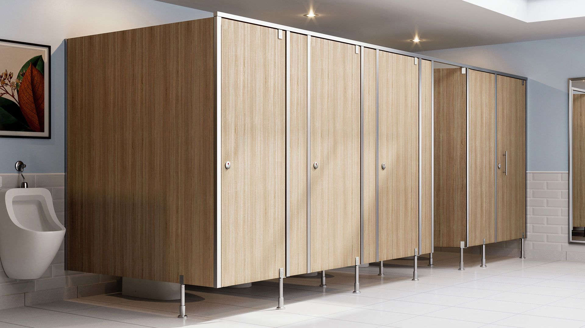 Public restroom stalls, light wood grain, stainless steel trim, and fixtures.