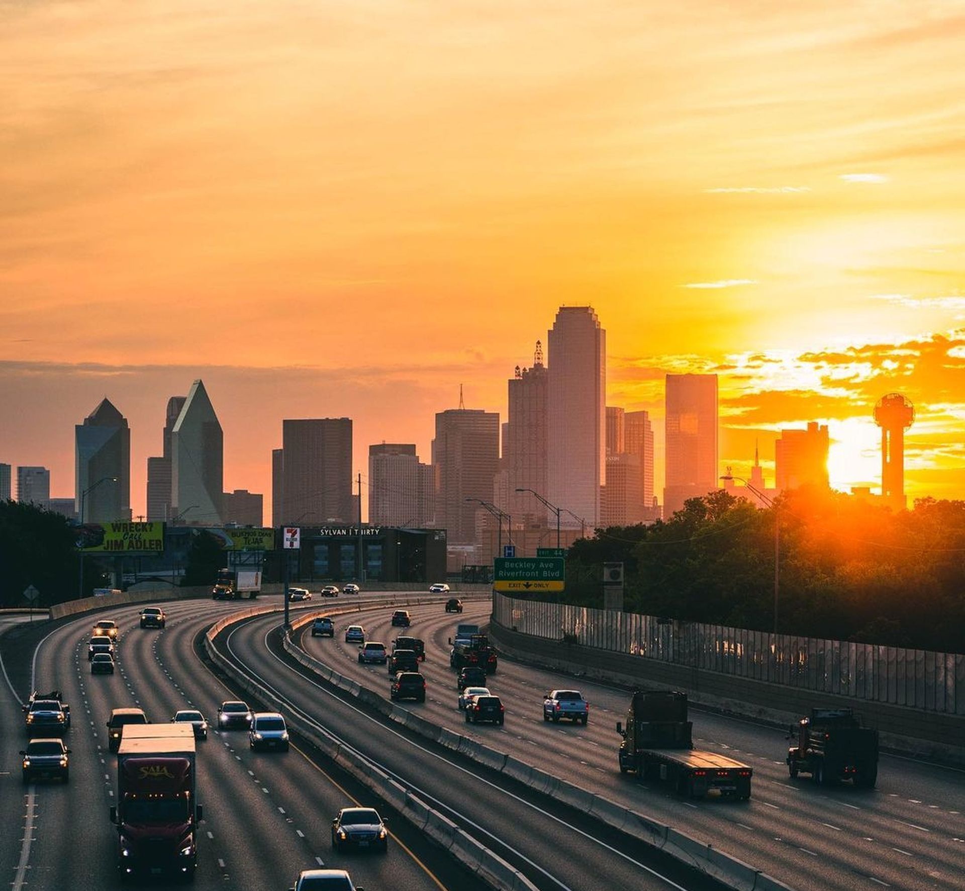 A city skyline with a brick chimney that says j.r. tower