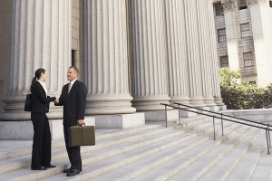 Lawyers standing in front of court building