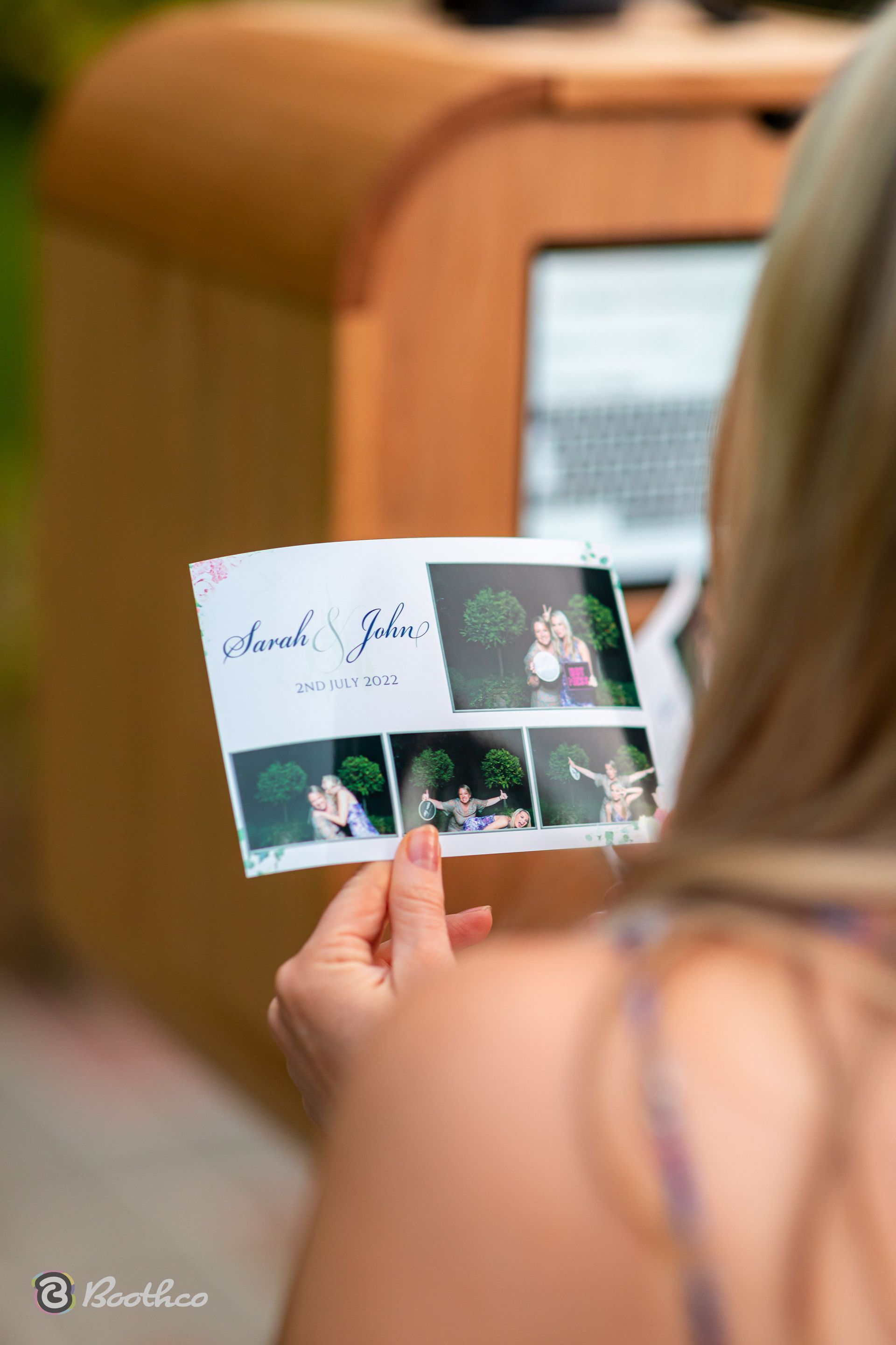 A person holding a photo strip featuring 