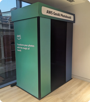 A teal AWS GenAI Photobooth kiosk with the text