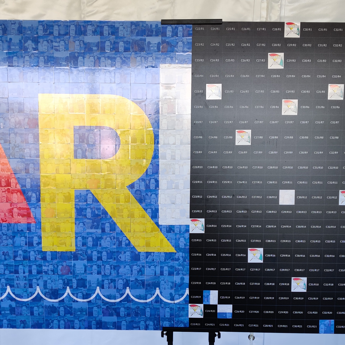 A large wall installation featuring a yellow 