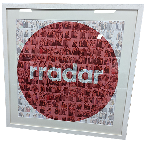 A framed photo collage in the shape of a large red circle against a white background, with the word 