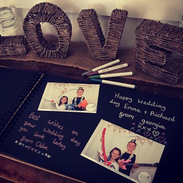 A wedding guest book featuring two photos, handwritten notes, and