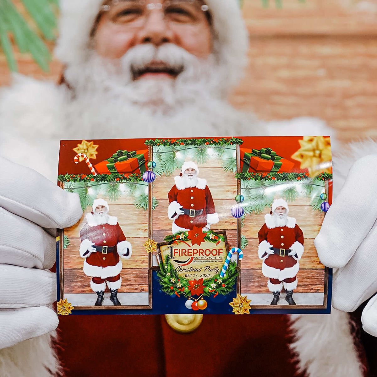 Santa Claus in a red suit and white gloves holds a photo strip featuring three portraits of himself and festive decor.