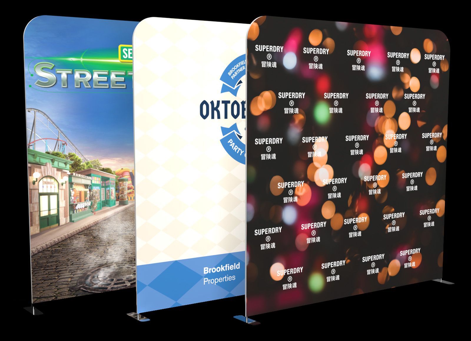 Three vertical, free-standing fabric banners with different custom printed designs, including an event backdrop.