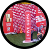 A Five Guys branded booth display with red backdrop banners, a vertical sign, and a promotional cutout on green flooring.