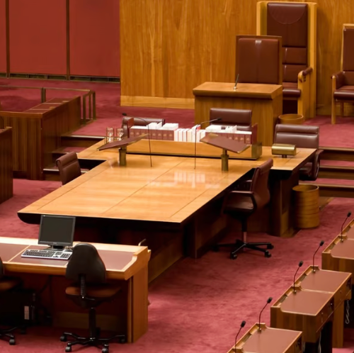 Screen Shot 2023-09-26 at 8.32.06 AM a conference room with a large wooden table and chairs
