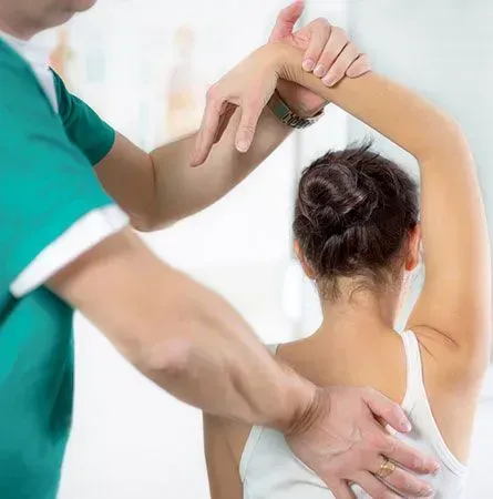 A man is giving a woman a massage on her back.