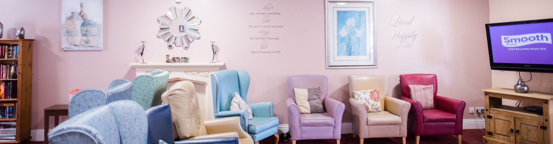 a living room with a lot of chairs and a television .