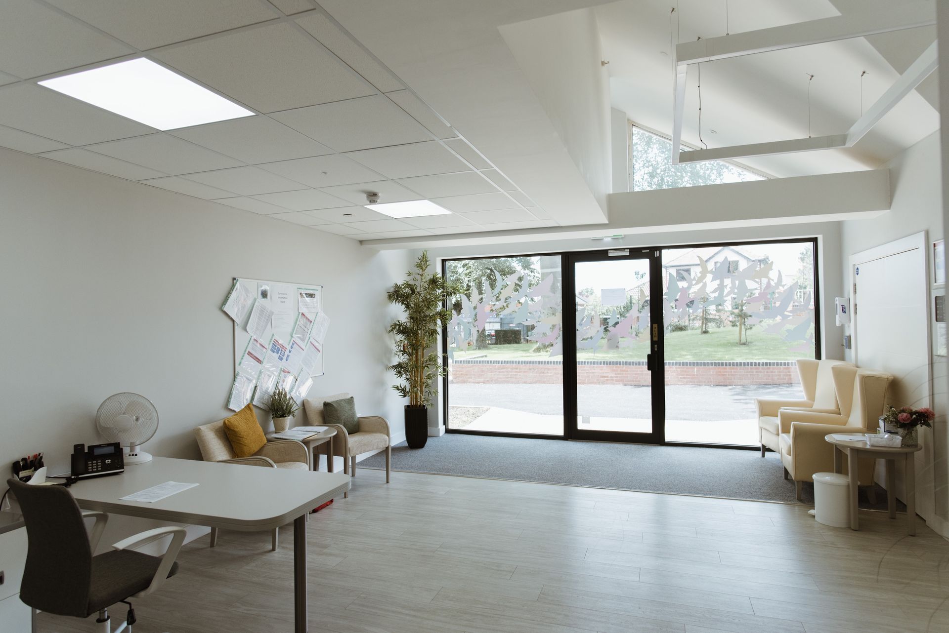 a large open room with a lot of windows and chairs