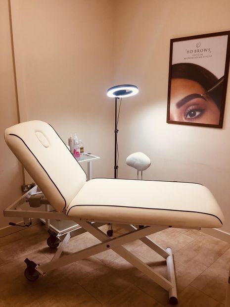 Beige reclining treatment chair 