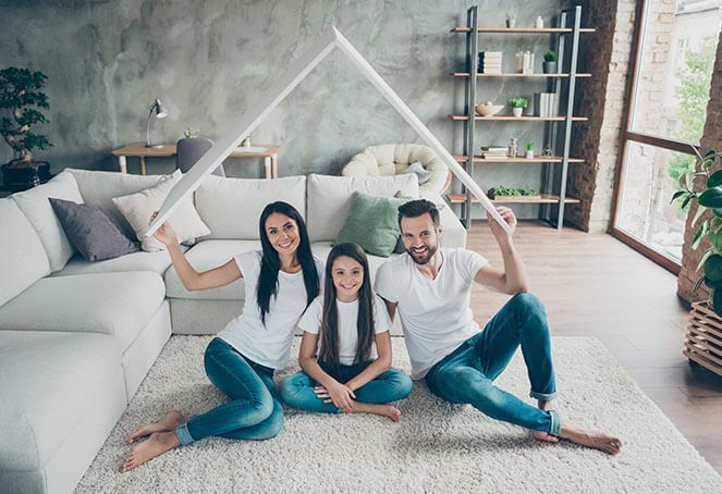 a family is sitting on the floor