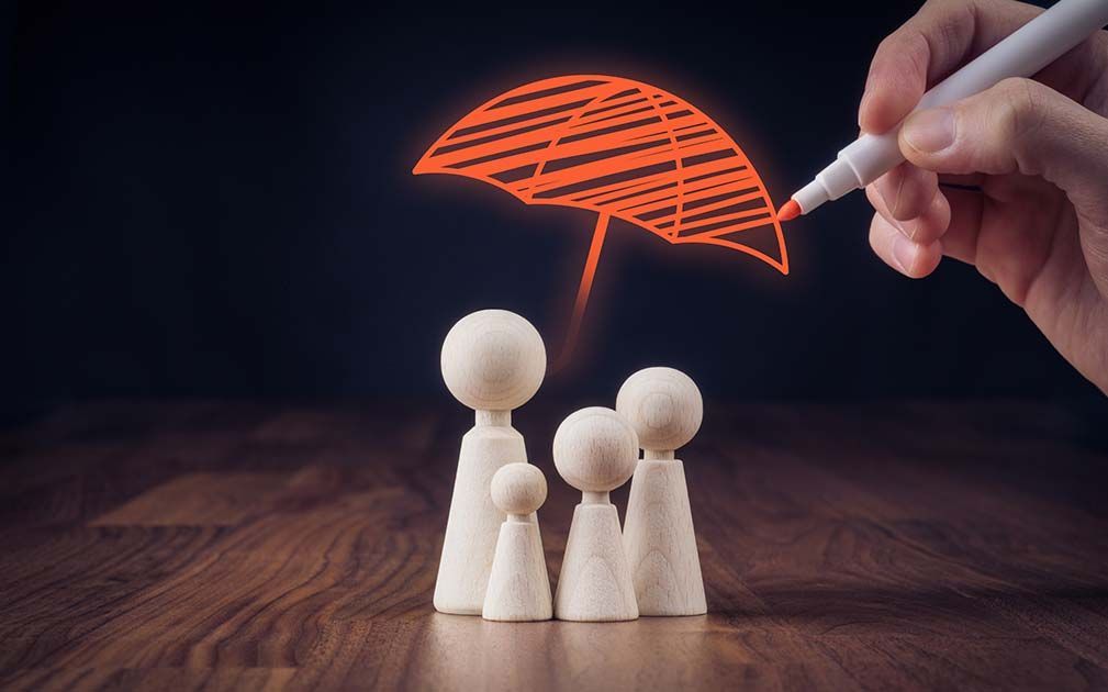 a person is drawing an umbrella over a family