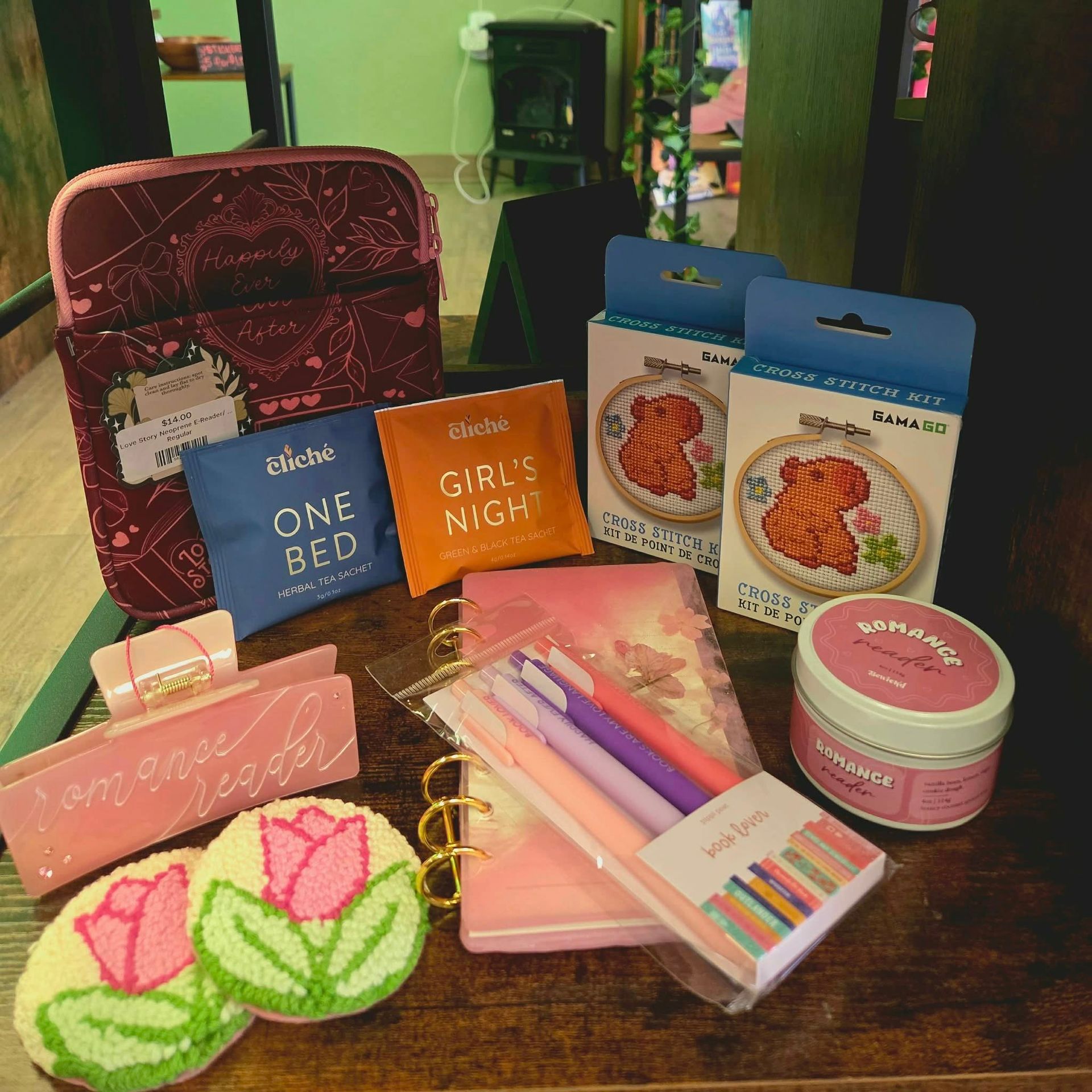 Gift basket with stationery, skincare, and facial masks on a wooden table
