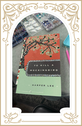 Decorative book cover with red, mint, and black design reading “To Kill a Mockingbird” by Harper Lee