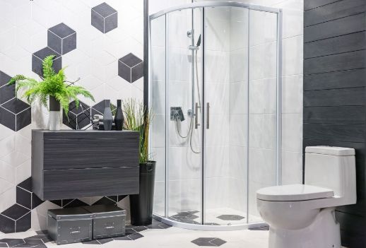 A Bathroom With a Toilet , Sink and Shower Stall — Precision Shower Screens & Wardrobes In Yarrawonga, NT