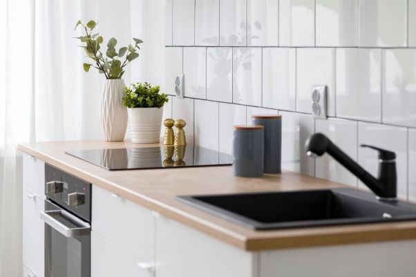 A Kitchen With a Sink, Stove, and Oven — Precision Shower Screens & Wardrobes In Yarrawonga, NT